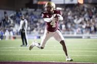 Zay Flowers #4 of the Boston College Eagles scores a touchdown during the first half of a game against the Duke Blue Devils